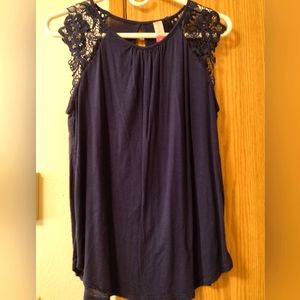 Dark blue shirt with short lacy like sleeves. Size medium.